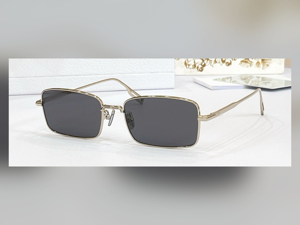 The Manhattan — slim rectangle sunglasses, gold wire frame, smoke lens